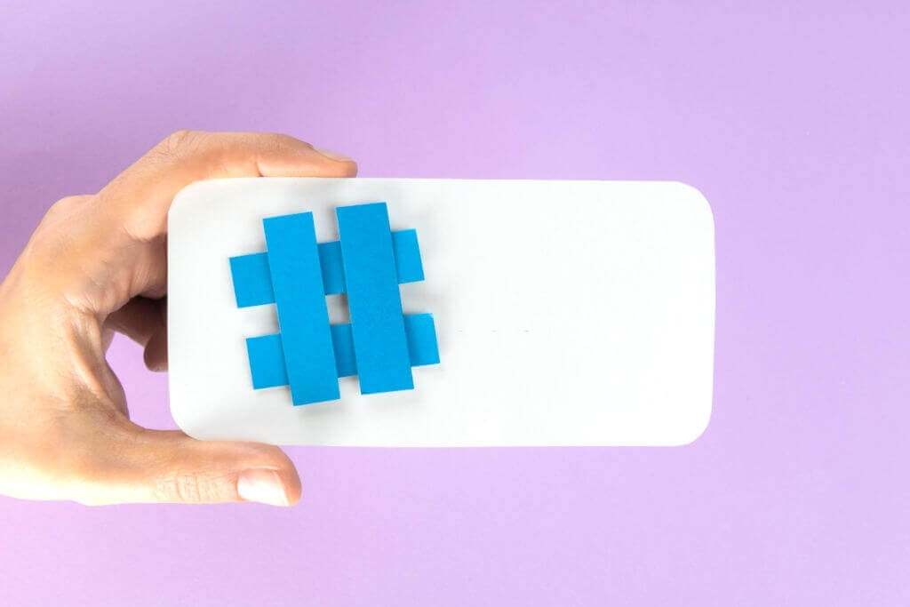 Hastag on a white cell phone Hastag on a white cell phone